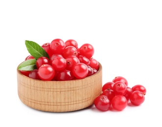 Photo of Fresh ripe cranberries with leaves on white background