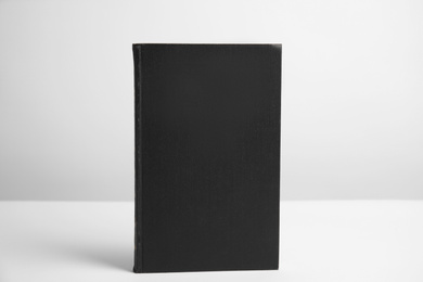 Hardcover book on white background. Space for design