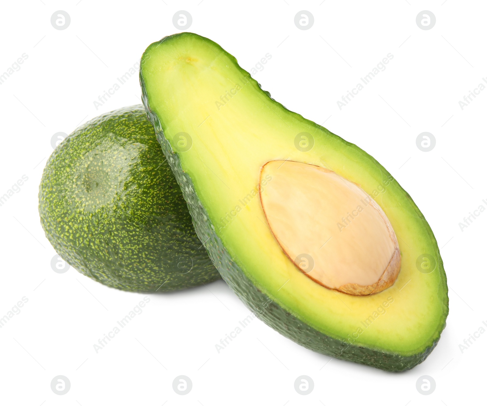 Photo of Tasty ripe avocados on white background. Tropical fruit