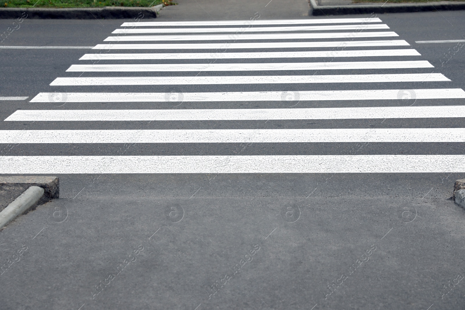 Photo of Pedestrian crossing on empty city street, closeup