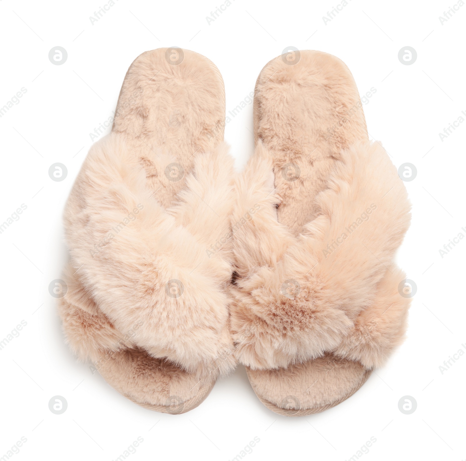 Photo of Pair of soft fluffy slippers on white background, top view