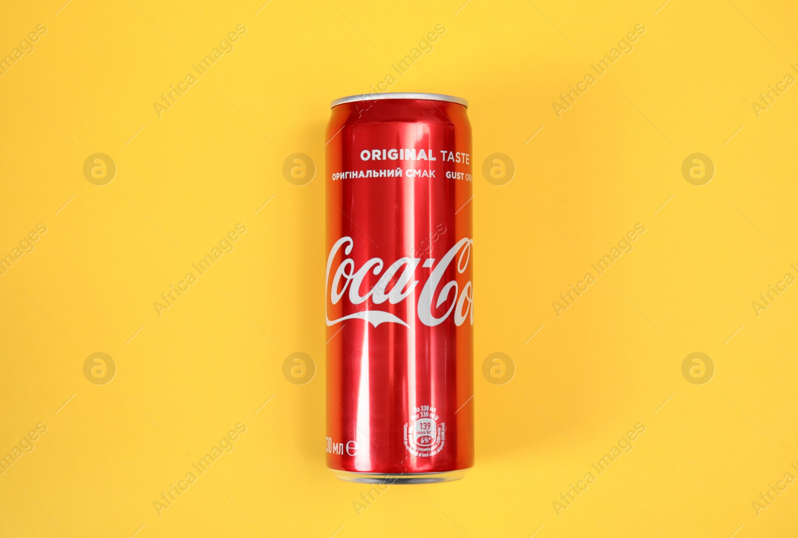 Photo of MYKOLAIV, UKRAINE - NOVEMBER 14, 2018: Coca-Cola can on color background, top view