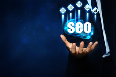 Image of Man demonstrating directions of SEO, closeup. Icons of keyword research, customization and others