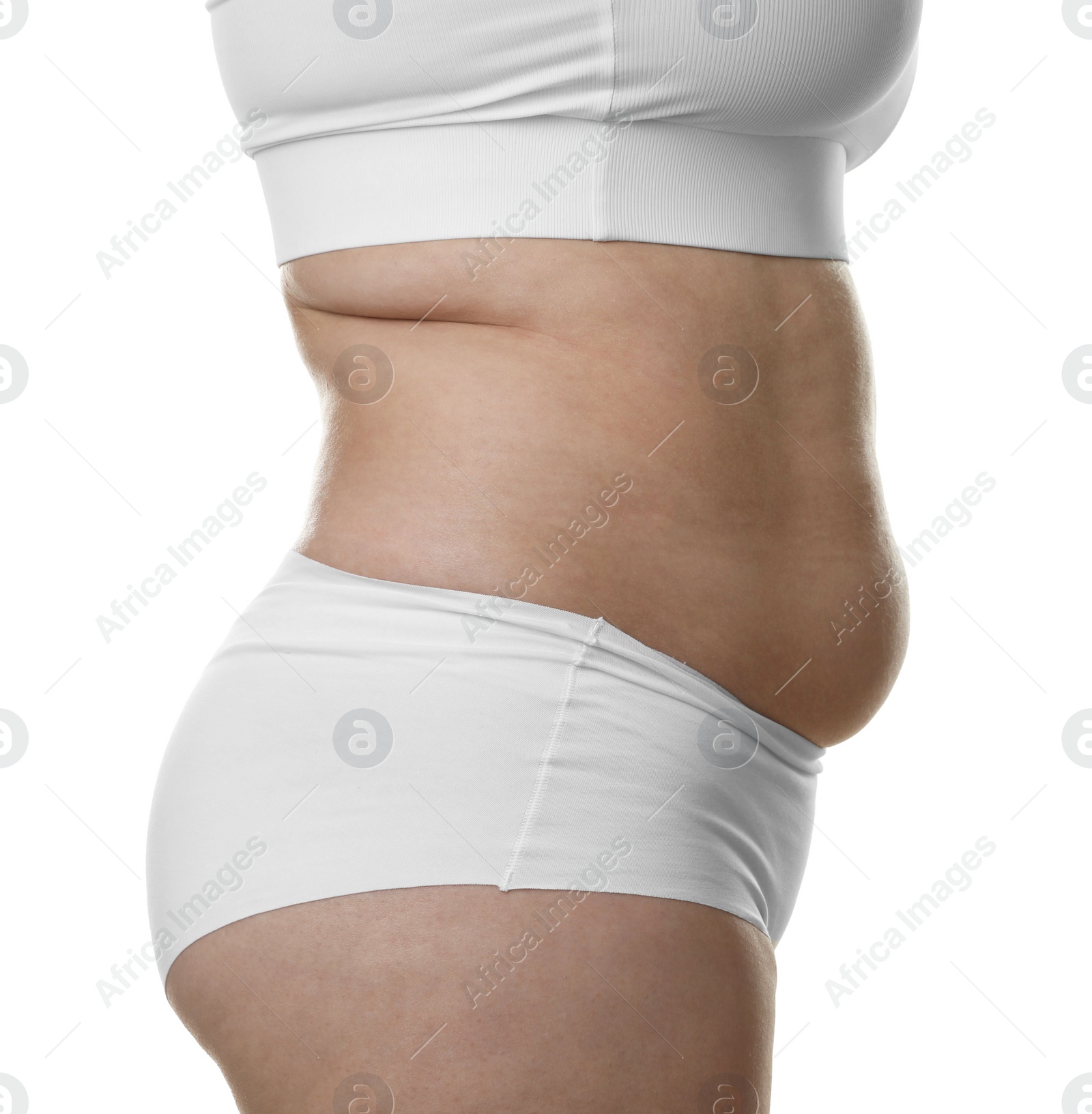 Photo of Woman with excessive belly fat on white background, closeup. Overweight problem