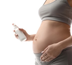 Photo of Pregnant woman with cosmetic product on white background, closeup