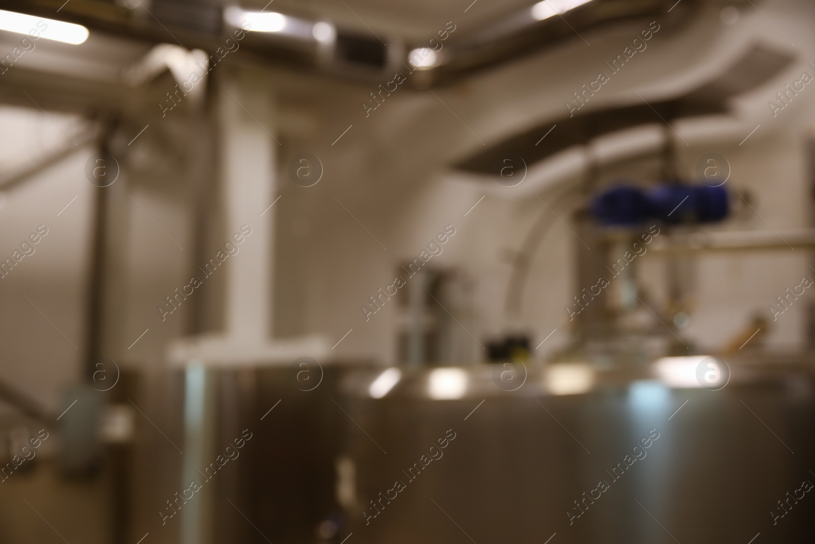 Photo of Blurred view of curd preparation tank at cheese factory