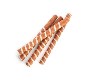 Delicious chocolate wafer rolls on white background. Sweet food