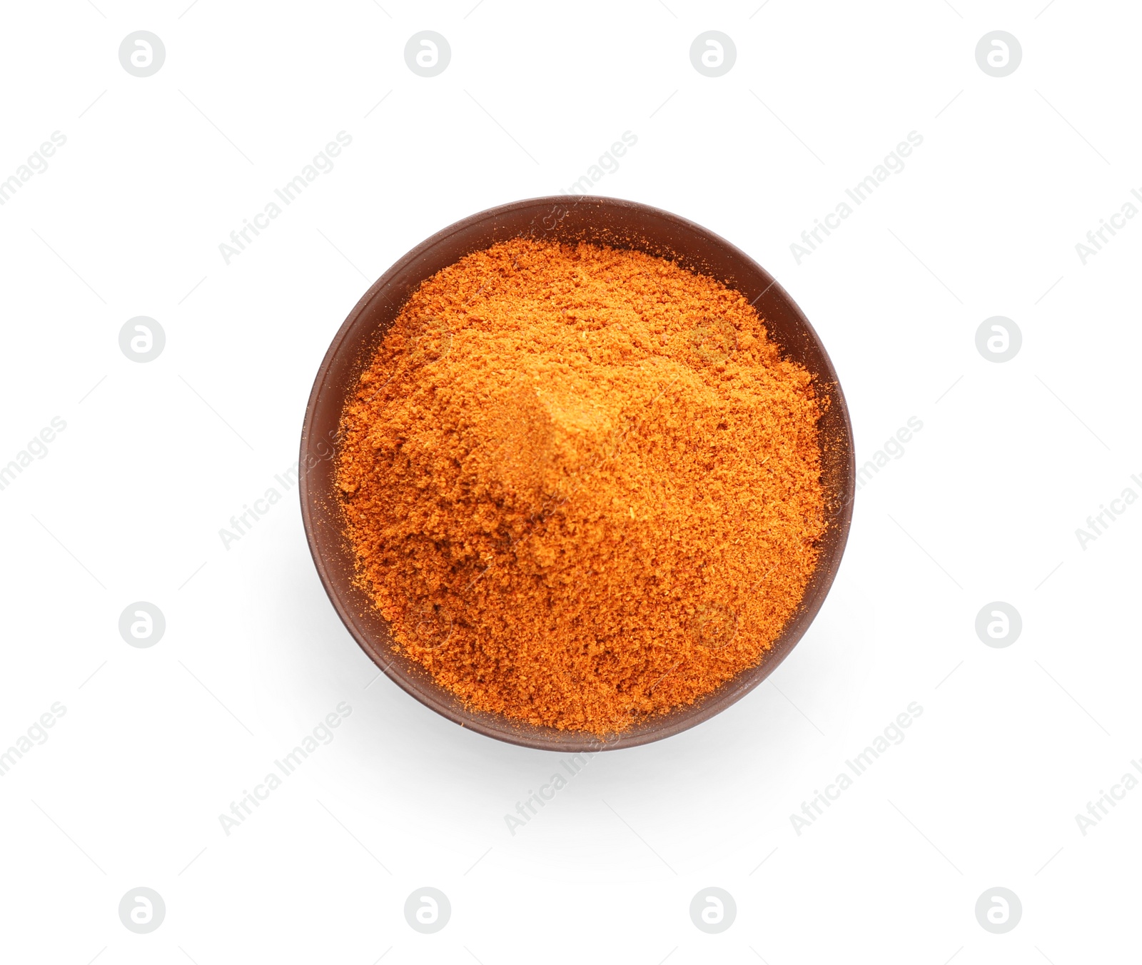 Photo of Bowl with red pepper powder on white background, top view