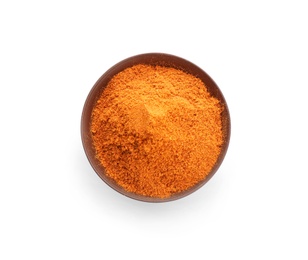 Bowl with red pepper powder on white background, top view