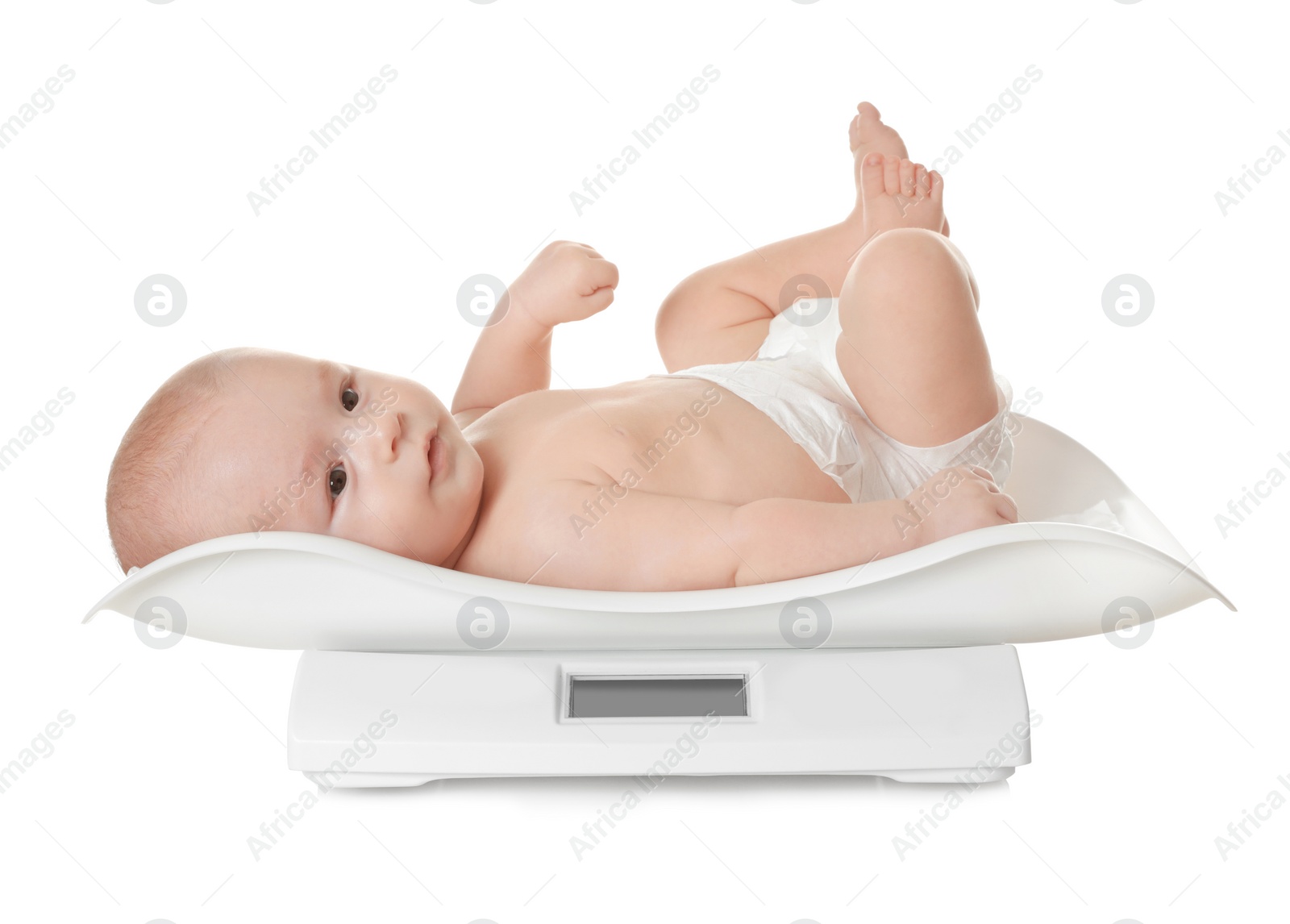 Photo of Cute little baby lying on scales against white background