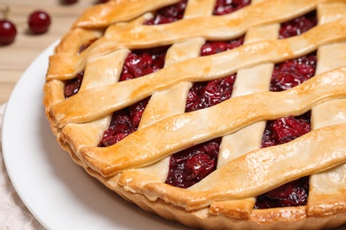 Photo of Delicious fresh cherry pie on tray, closeup