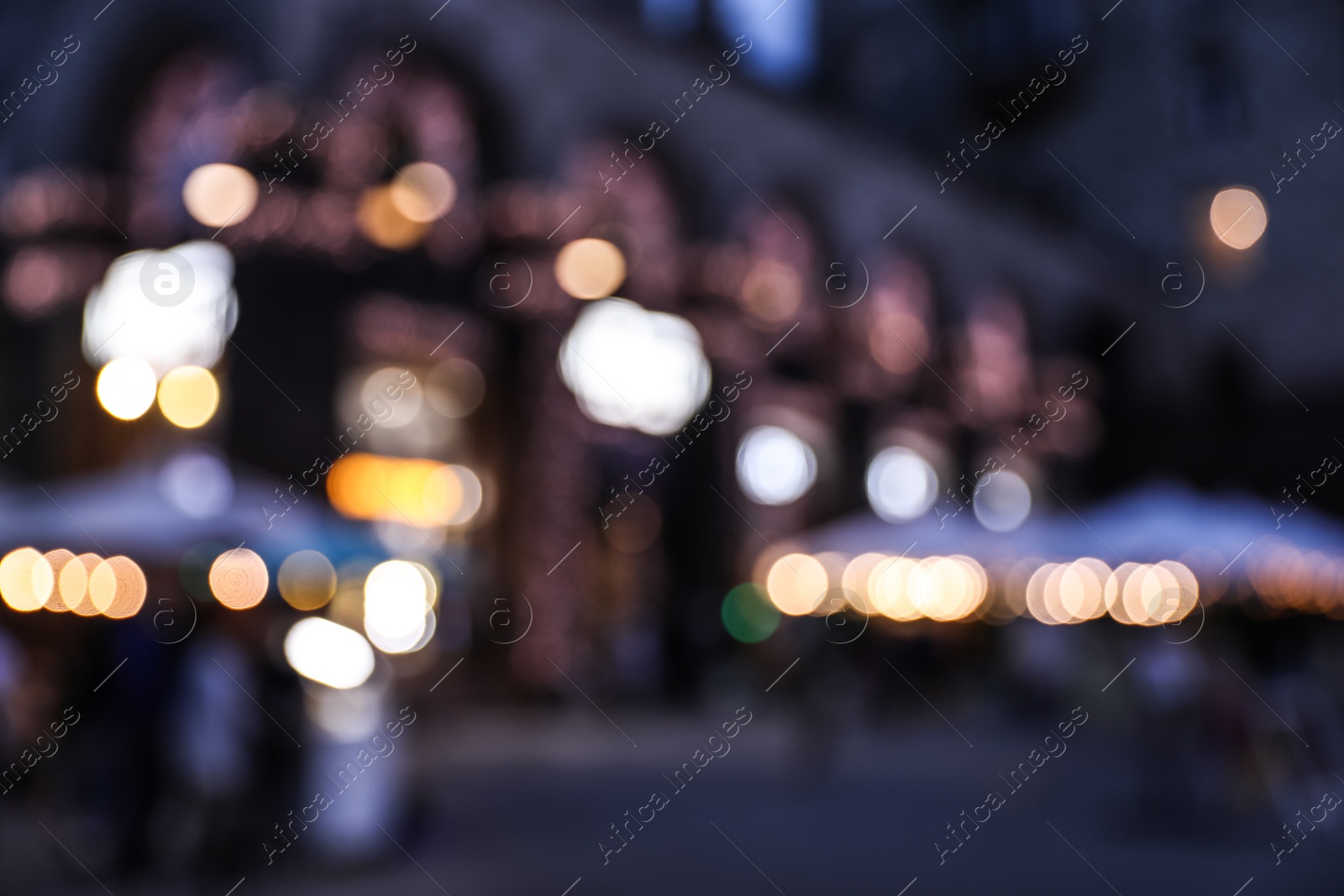 Photo of Blurred view of modern city at evening. Bokeh effect