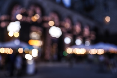 Photo of Blurred view of modern city at evening. Bokeh effect