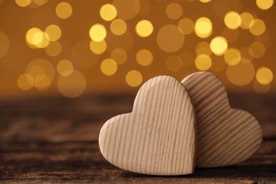 Decorative hearts on wooden table, space for text. Valentine's Day