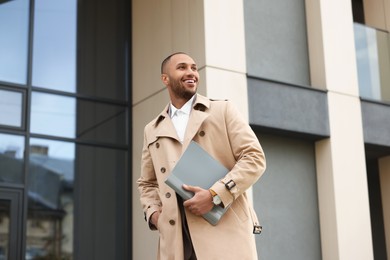 Photo of Happy man with folders outdoors. Lawyer, businessman, accountant or manager