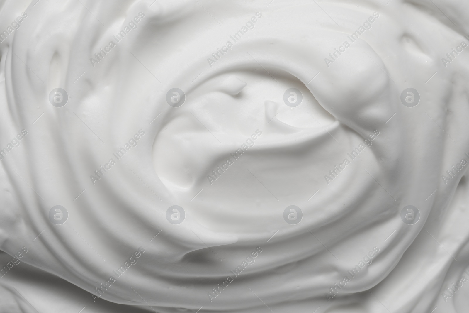 Photo of Texture of white shaving foam as background, top view