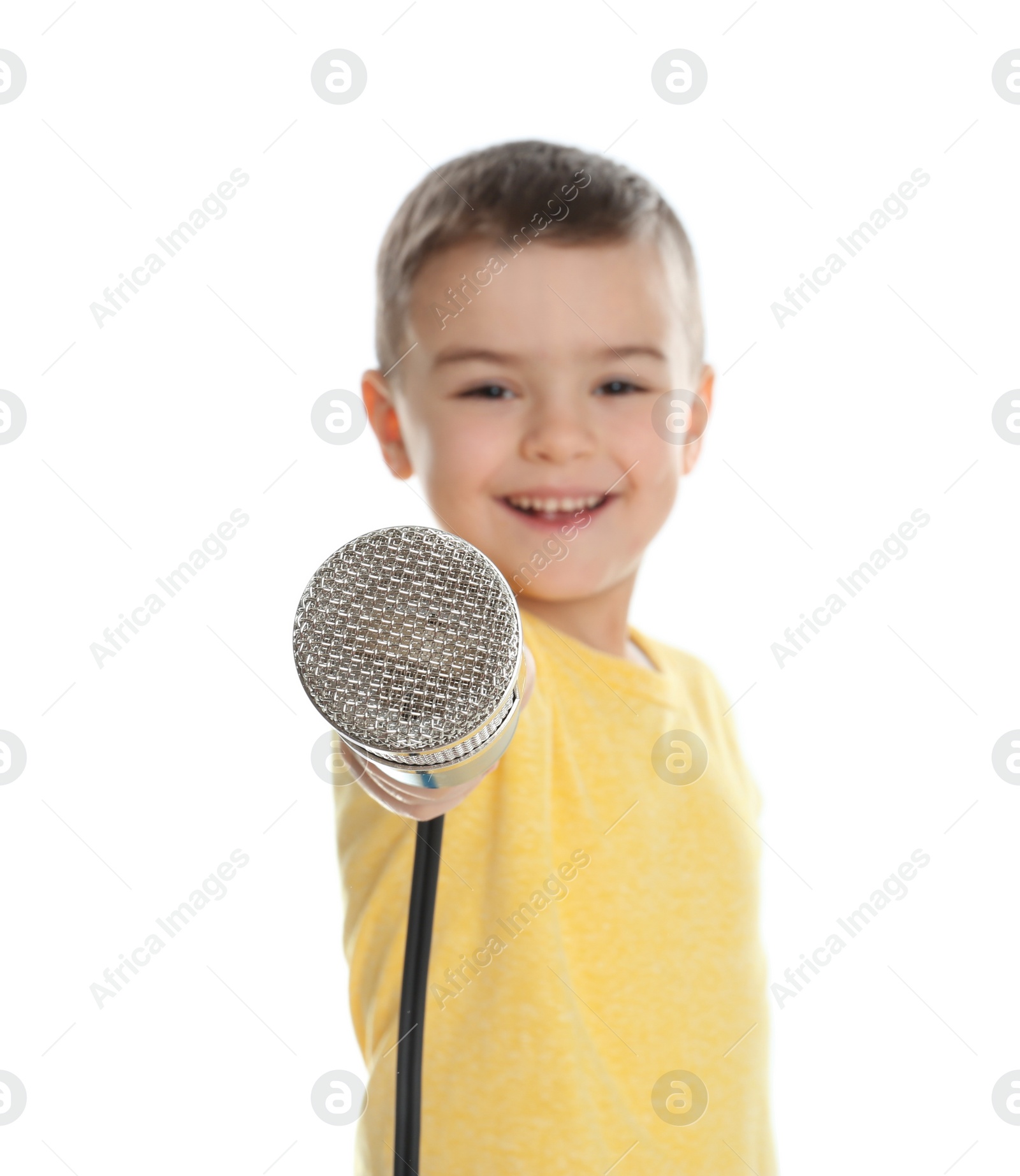 Photo of Cute funny boy with microphone on white background