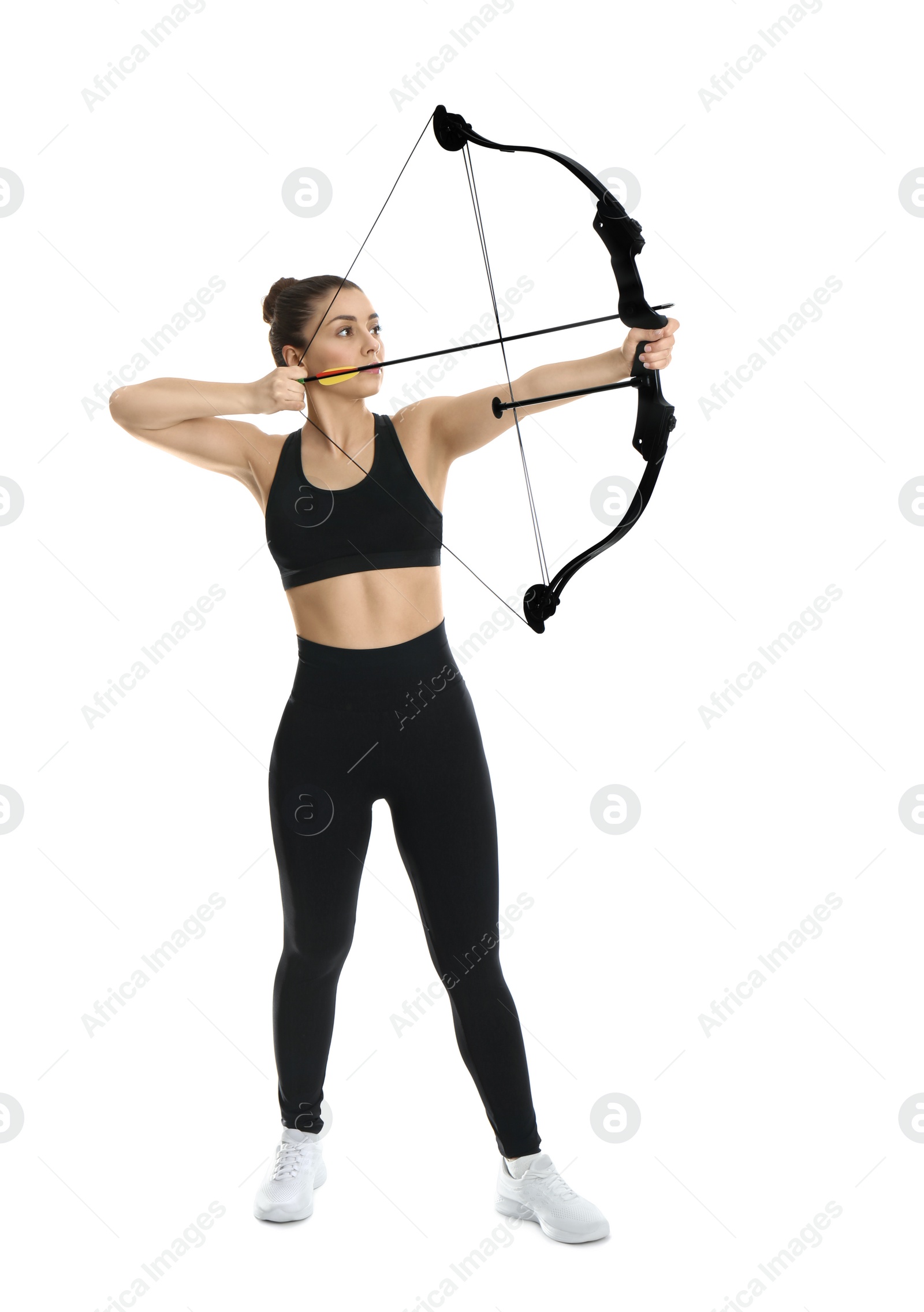 Photo of Woman with bow and arrow practicing archery on white background