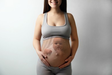 Double exposure of pregnant woman and cute baby on light background