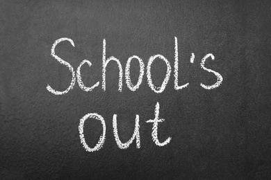 Photo of Words School's Out on blackboard. Summer holidays