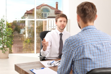 Human resources manager conducting job interview with applicant in office