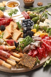 Photo of Many different tasty appetizers on table, closeup