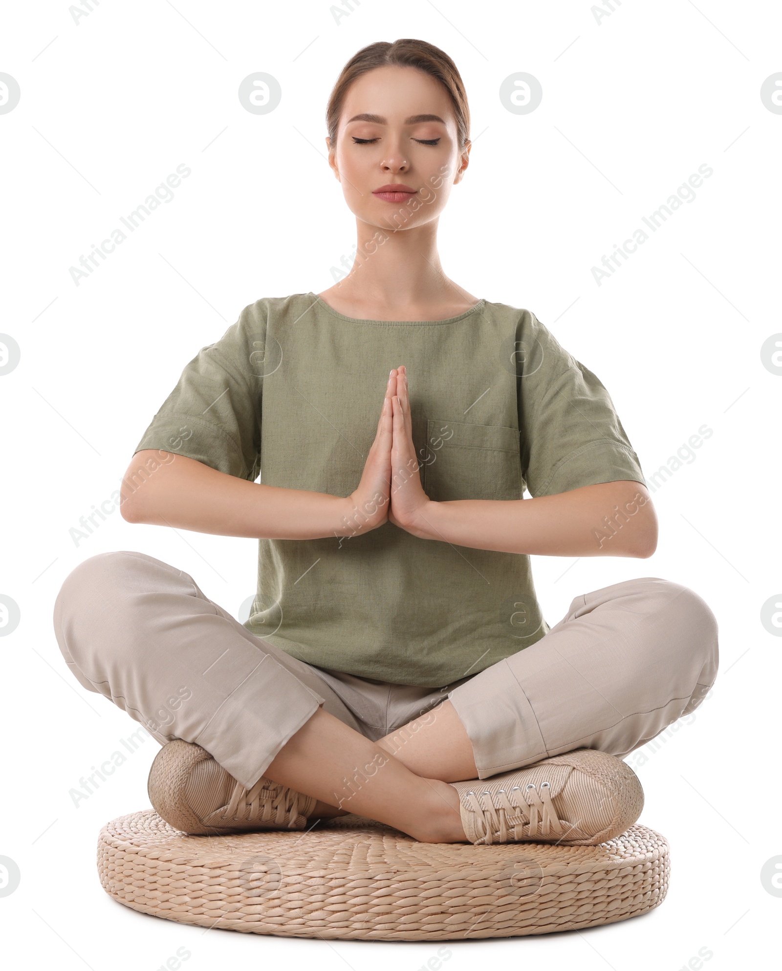 Photo of Beautiful young woman meditating on white background