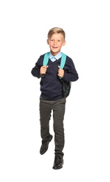 Little boy in stylish school uniform on white background