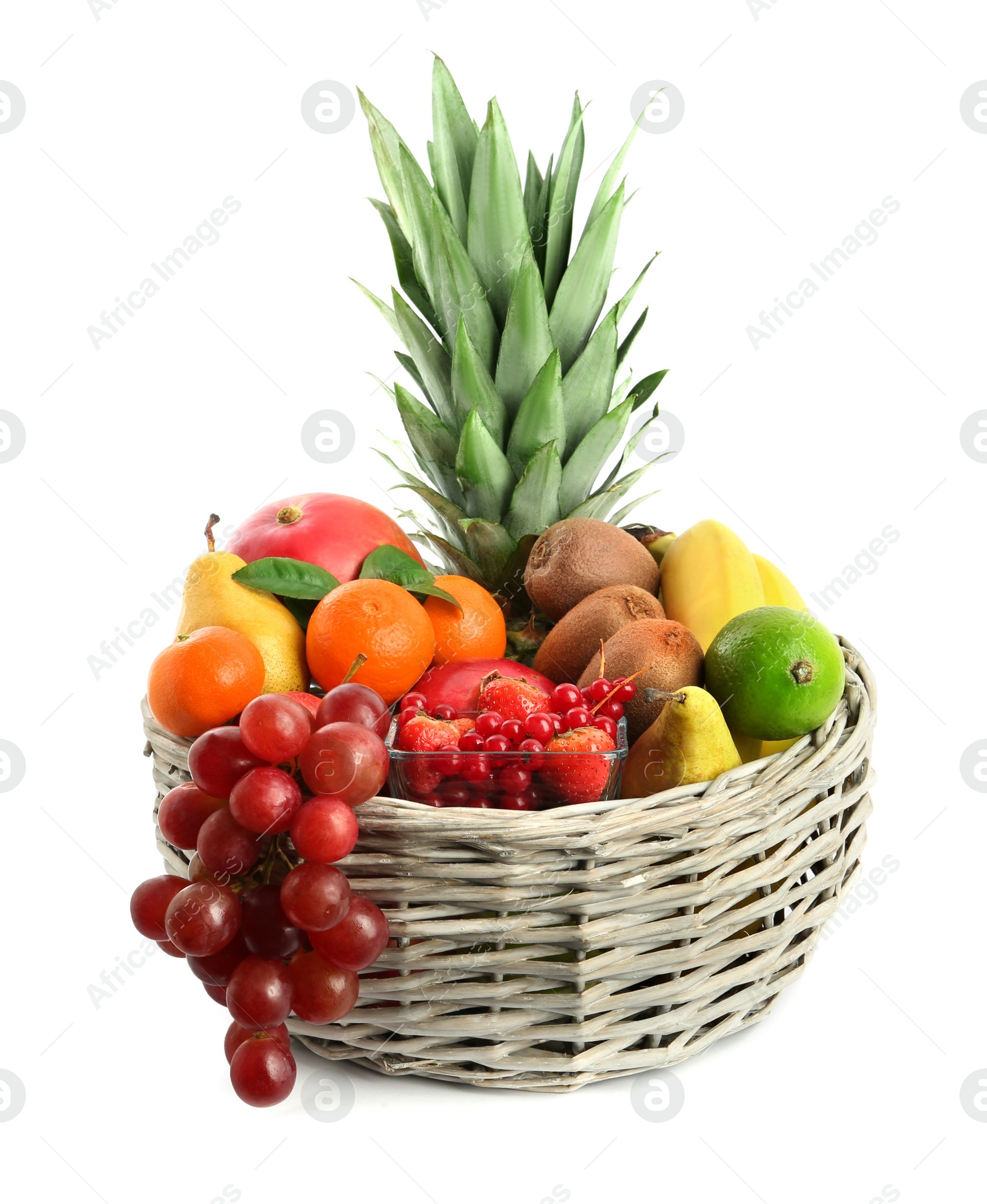 Photo of Wicker basket with different fresh fruits isolated on white