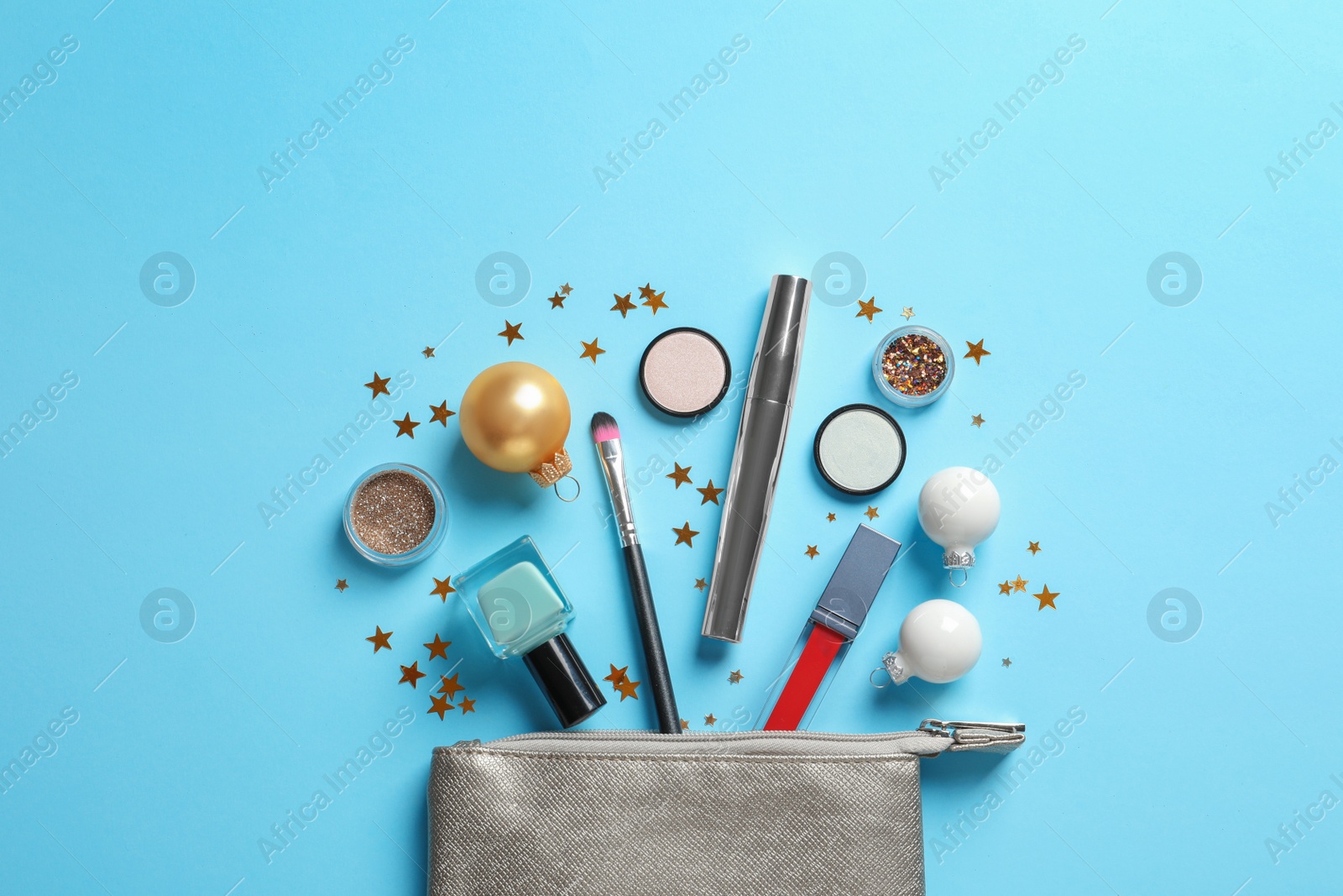 Photo of Flat lay composition with makeup products and Christmas decor on color background