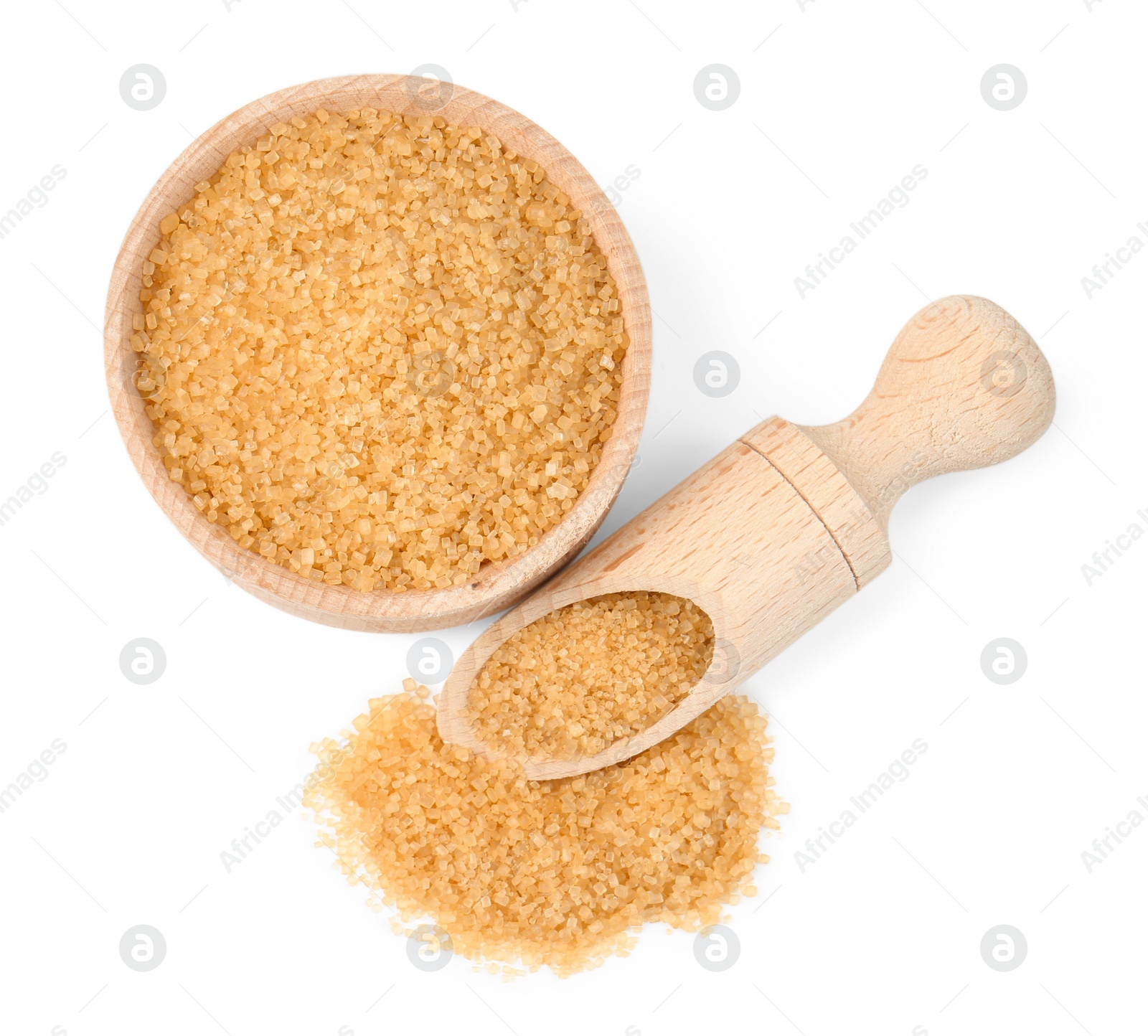 Photo of Brown sugar in bowl and scoop isolated on white, top view