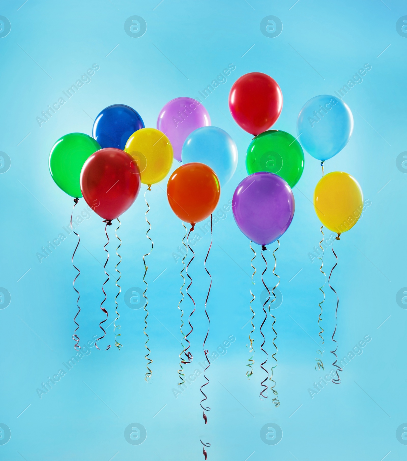 Photo of Bright balloons on color background. Celebration time