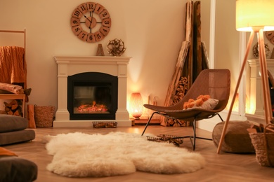 Photo of Beautiful view of cozy living room interior with fireplace