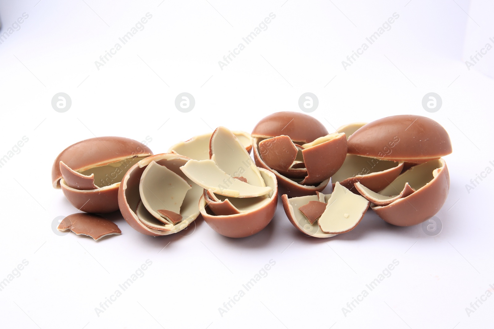 Photo of Sveti Vlas, Bulgaria - July 3, 2023: Broken halves of Kinder Surprise Eggs isolated on white