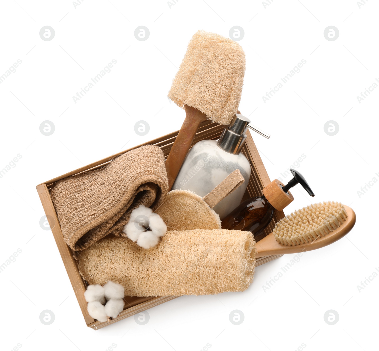 Photo of Set of toiletries with natural loofah sponges in wooden crate isolated on white, top view