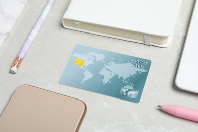 Photo of Composition with credit card and stationery on light grey marble background