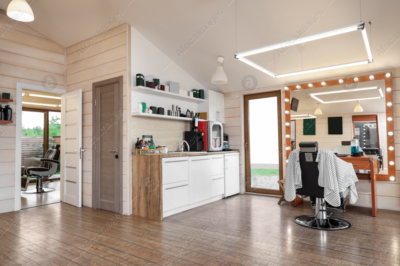 Photo of Stylish barbershop interior with professional hairdresser's workplace