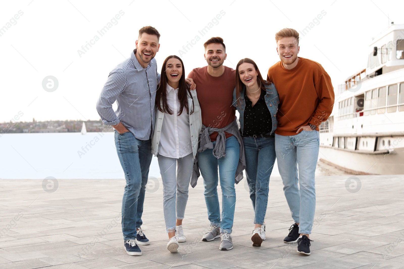 Photo of Group of happy people spending time together at promenade