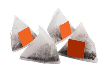 Many new pyramid tea bags on white background