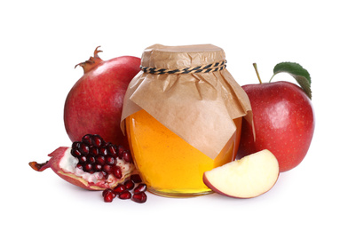Photo of Honey, apples and pomegranate on white background. Rosh Hashanah holiday