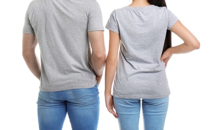 Young couple in t-shirts on white background. Mockup for design