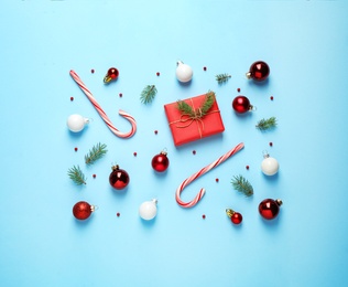 Flat lay composition with Christmas decorations on light blue background