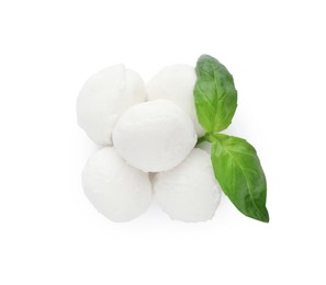 Photo of Delicious mozzarella cheese balls and basil on white background, top view