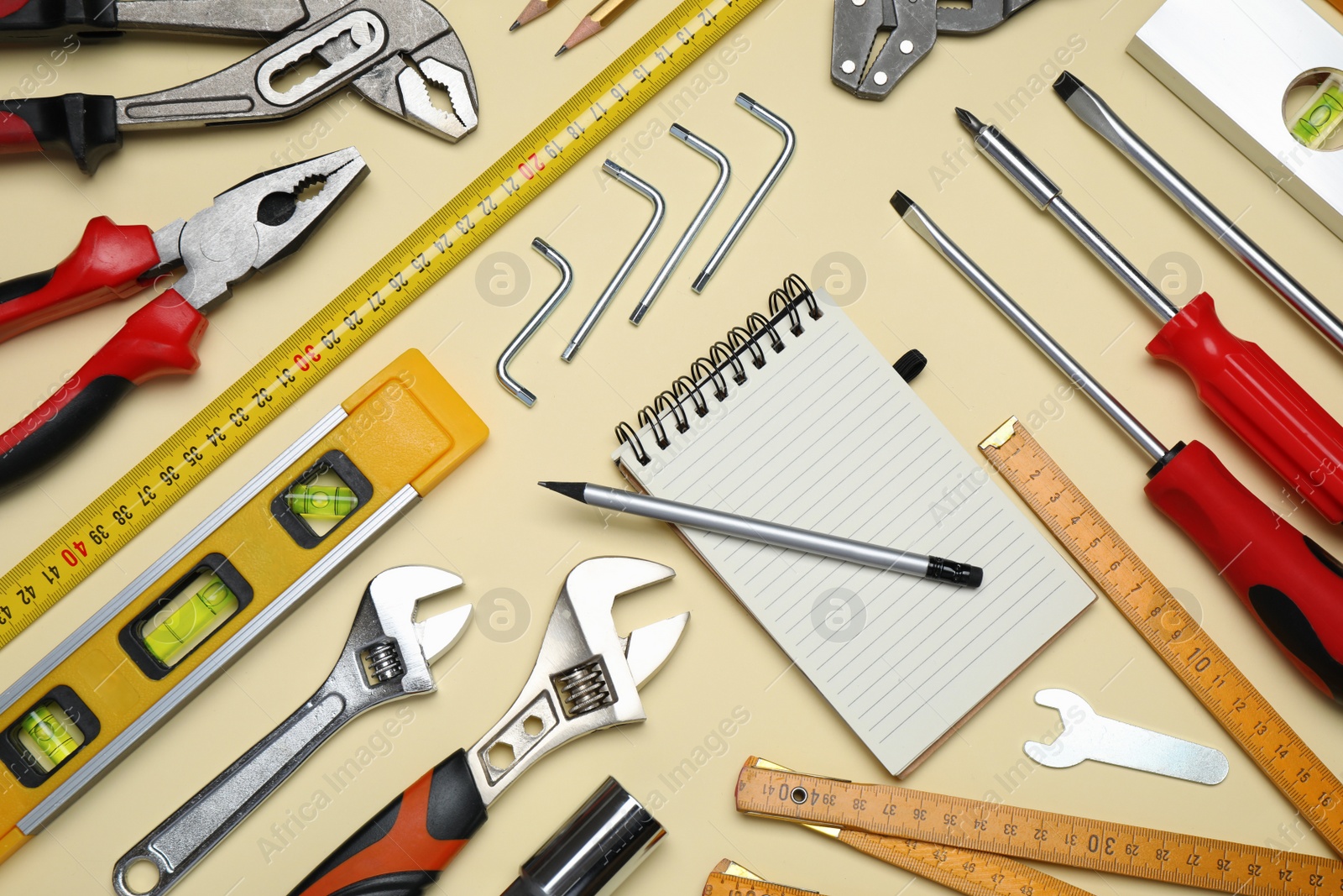 Photo of Flat lay composition with different tools on beige background