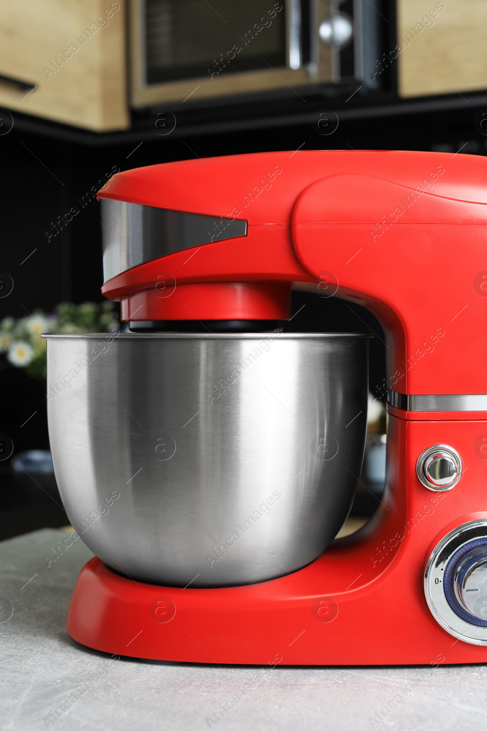 Photo of Modern stand mixer on table in kitchen, closeup