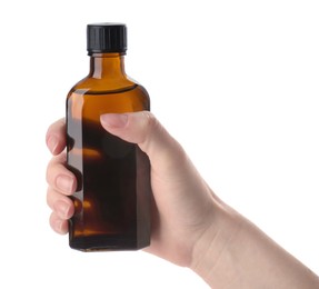 Woman holding bottle of syrup isolated on white, closeup. Cough and cold medicine