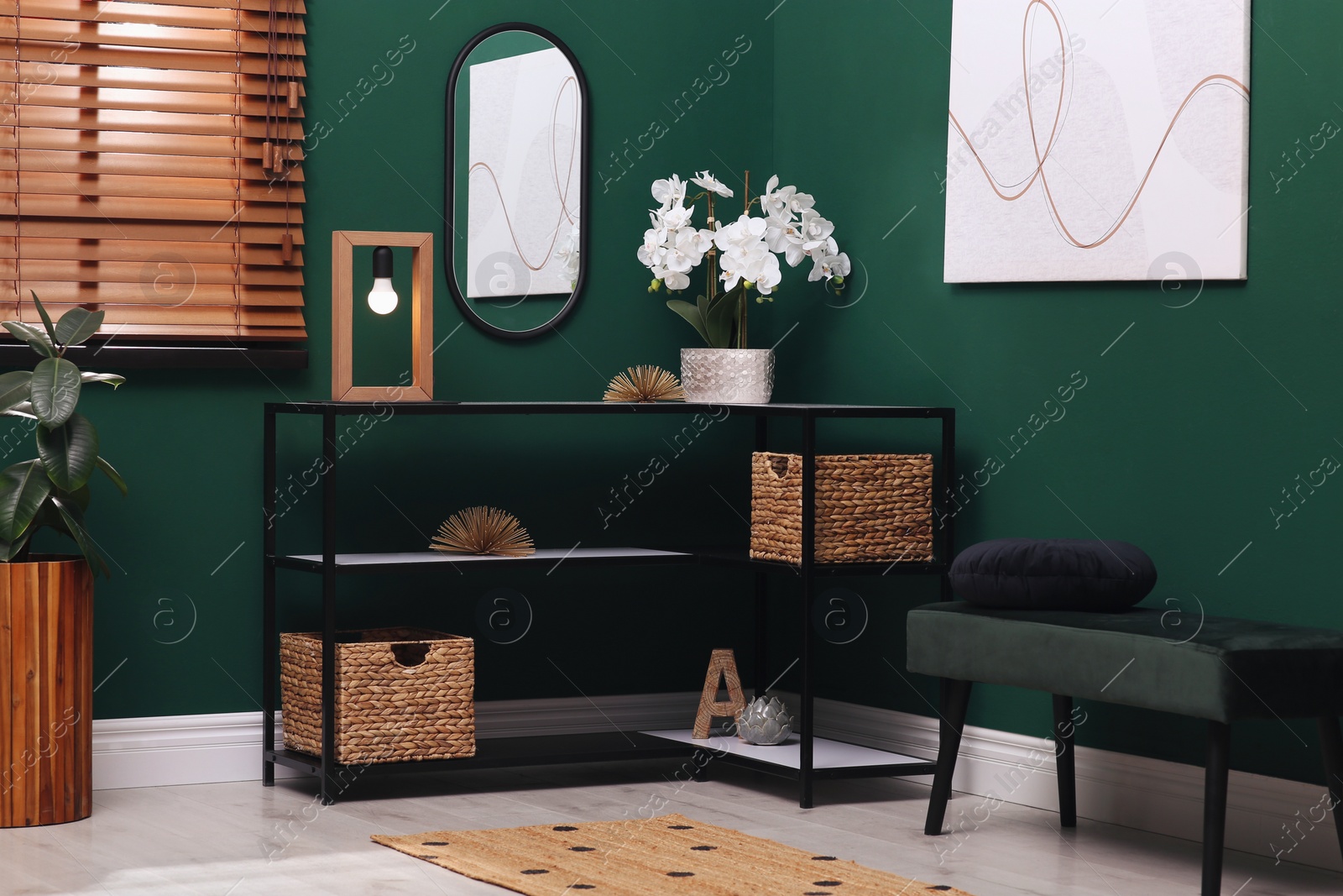 Photo of Modern hallway interior with beautiful orchid flower on console table near comfortable bench