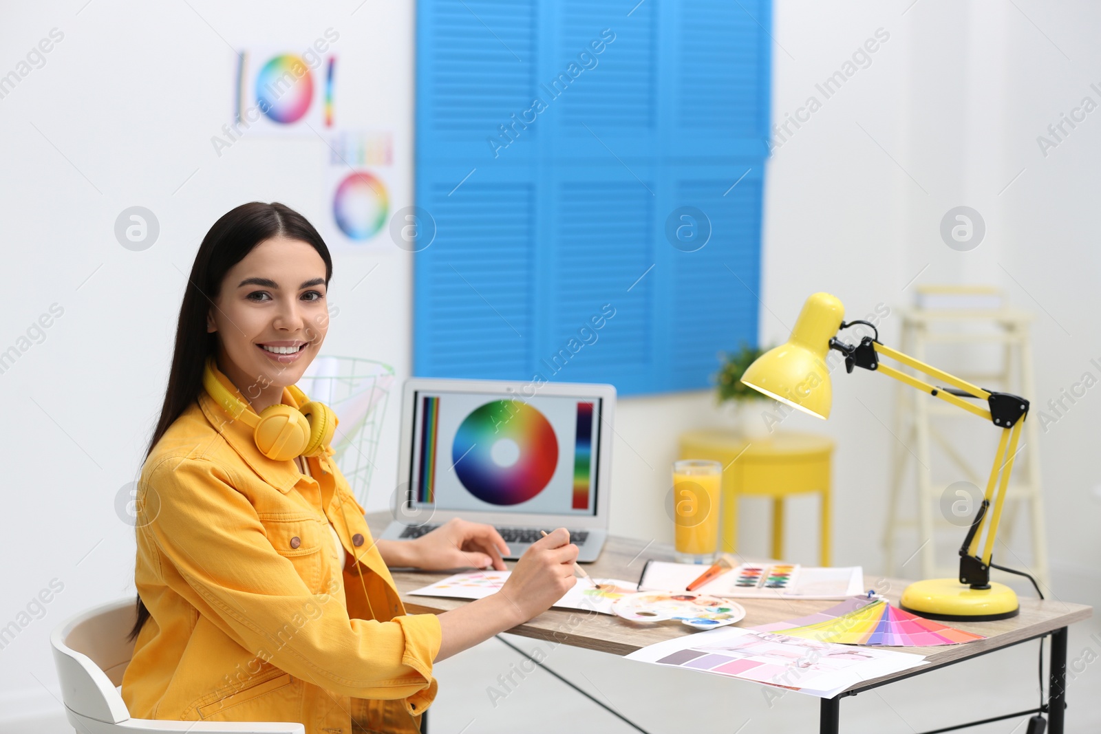 Photo of Female designer working at desk in office