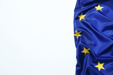 Photo of Flag of European Union on white background, top view. Space for text