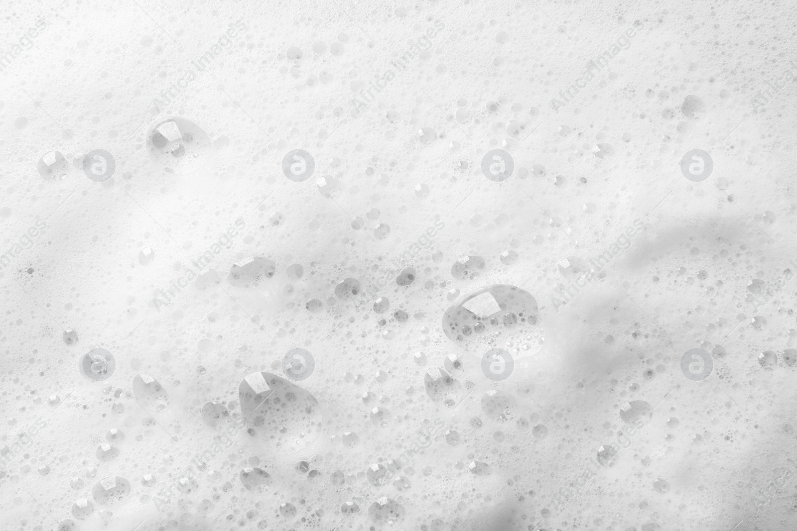 Photo of Fluffy soap foam as background, top view